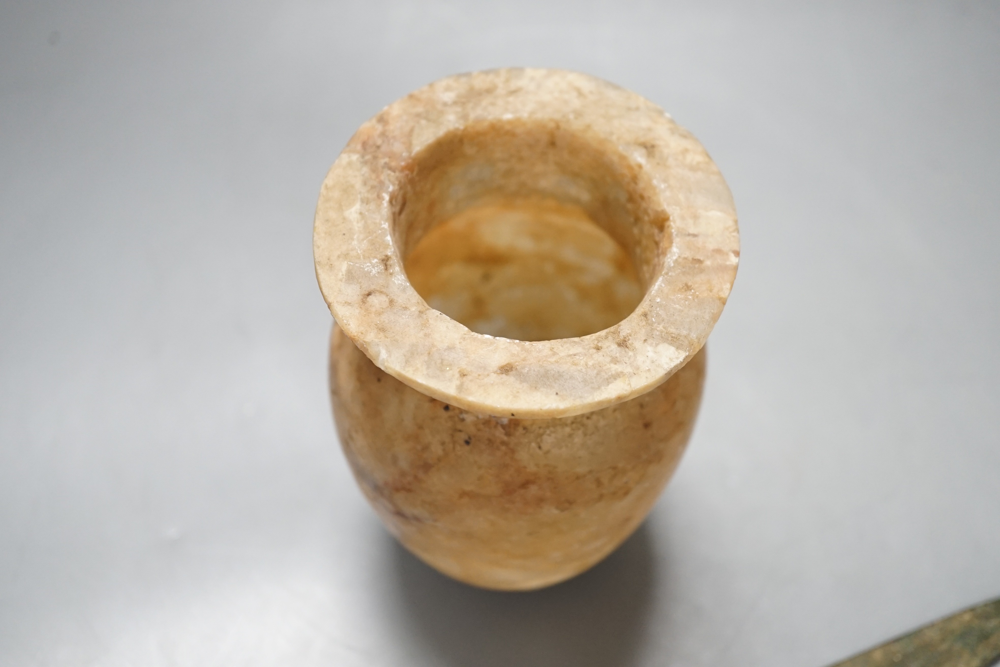 Antiquities to include a Luristan bronze spear head, an Egyptian ushabti (af) and an alabaster jar, spear head 30.5cm long